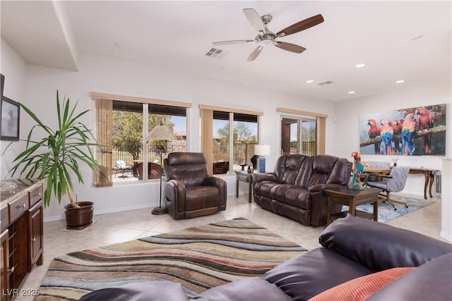 living room featuring a ceiling fan, recessed lighting, visible vents, and light tile patterned floors