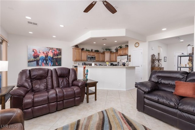 living room featuring a ceiling fan, recessed lighting, visible vents, and light tile patterned flooring