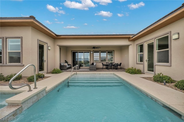 outdoor pool with a patio and a ceiling fan