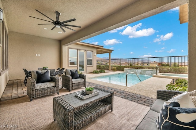 view of swimming pool featuring a patio, a ceiling fan, a fenced in pool, a fenced backyard, and an outdoor hangout area