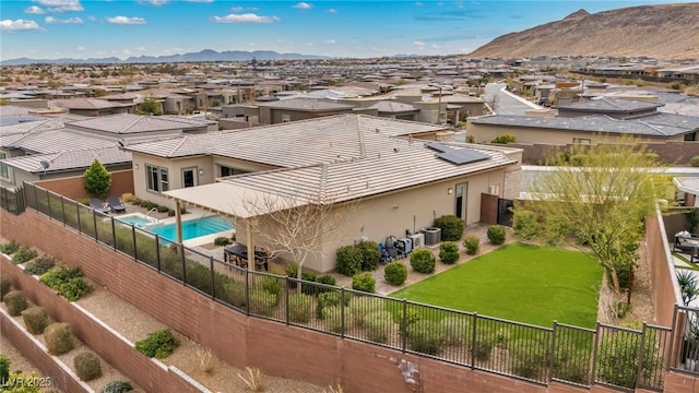 birds eye view of property with a mountain view and a residential view