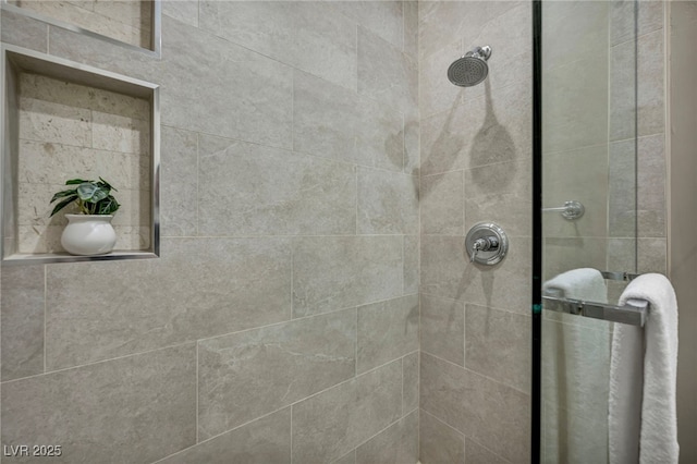 full bathroom with a tile shower