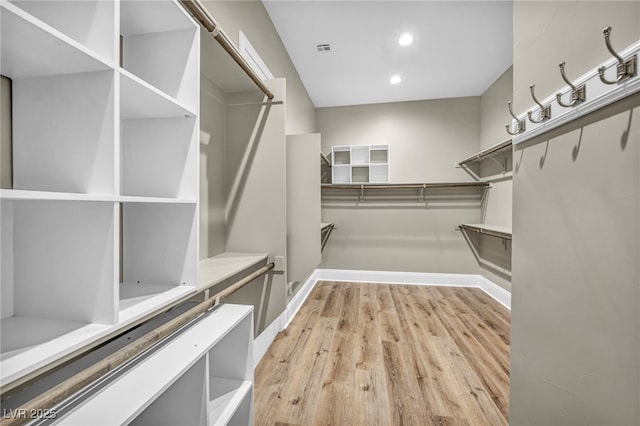 walk in closet with visible vents and light wood-style flooring