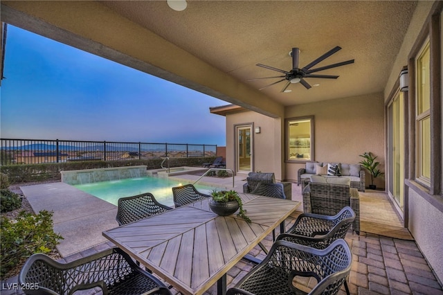 view of patio featuring outdoor dining space, an outdoor hangout area, a fenced backyard, and ceiling fan