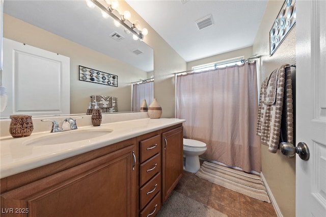 bathroom featuring toilet, tile patterned flooring, vanity, and visible vents