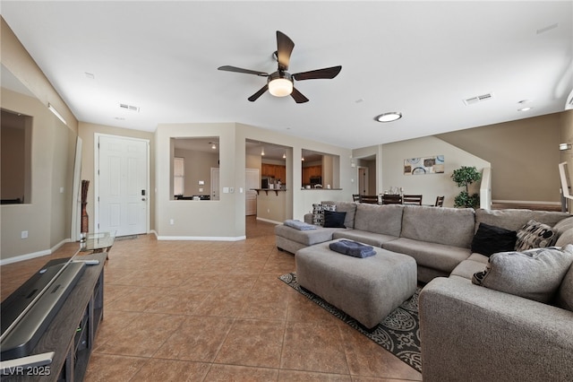 6030 Hidden Summit St, North Las Vegas, NV 89031 - living area with ceiling fan and light tile patterned flooring