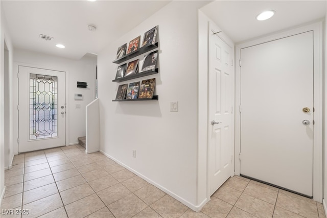 foyer entrance with recessed lighting, visible vents, baseboards, and light tile patterned floors