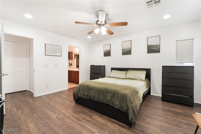 bedroom featuring dark wood-style flooring, visible vents, and recessed lighting