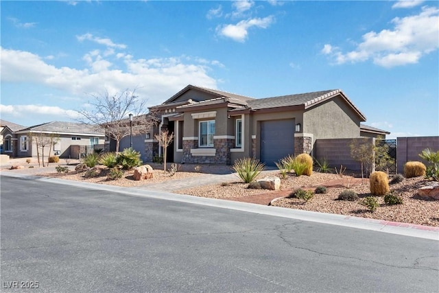 view of front of house featuring an attached garage, stone siding, fence, and stucco siding