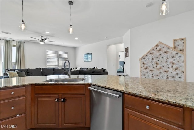 kitchen featuring brown cabinets, visible vents, open floor plan, a sink, and dishwasher