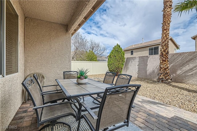 view of patio / terrace featuring outdoor dining space and fence private yard