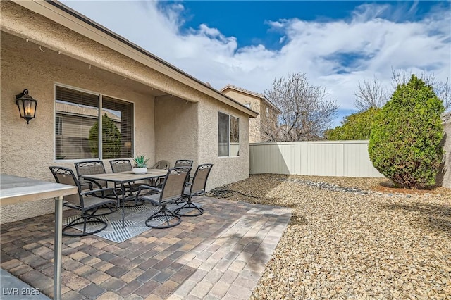 view of patio / terrace featuring outdoor dining area and fence