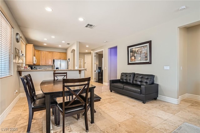 dining area with baseboards, visible vents, and recessed lighting