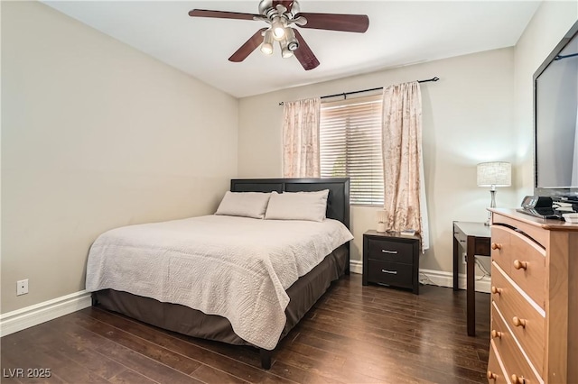 bedroom with dark wood-style flooring, ceiling fan, and baseboards