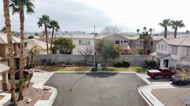 exterior space featuring a residential view and fence private yard