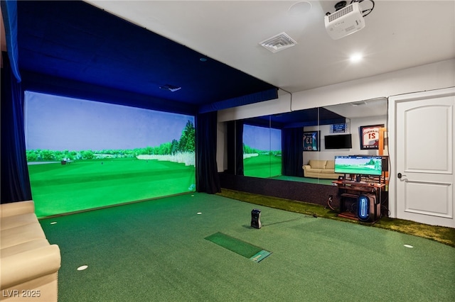 home theater room with golf simulator and visible vents