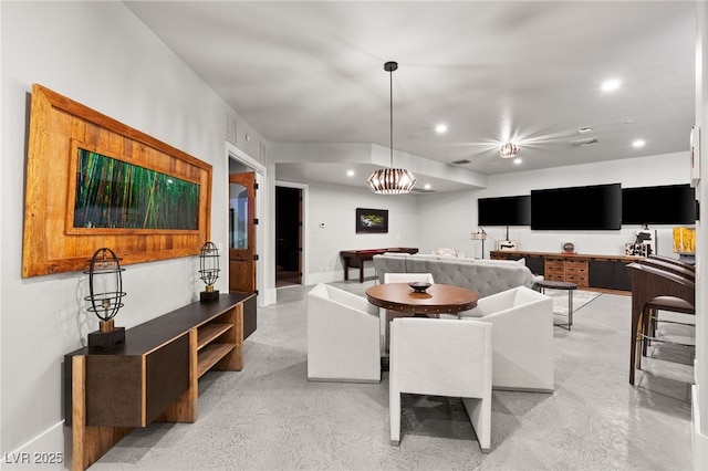 living area featuring recessed lighting, visible vents, finished concrete flooring, and baseboards