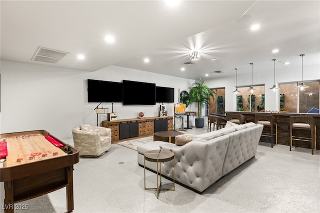 living area with recessed lighting and visible vents