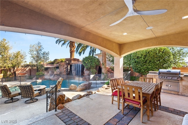 view of patio / terrace with a fenced backyard, a fire pit, area for grilling, a grill, and outdoor dining space