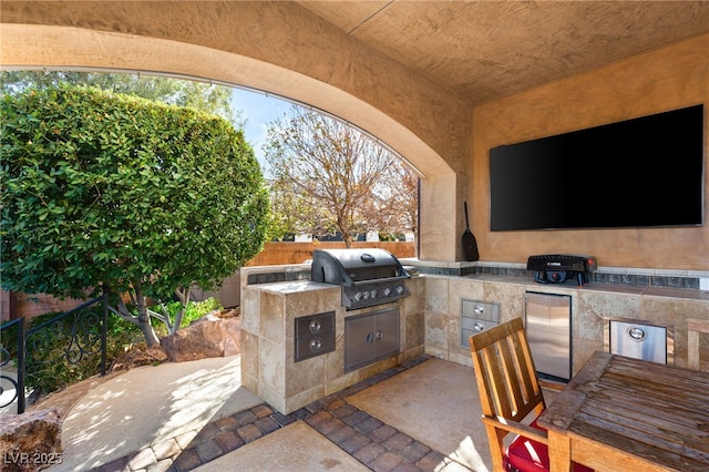 view of patio / terrace with fence and area for grilling