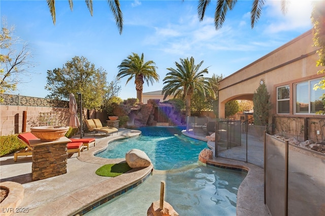 view of swimming pool with a patio area, a fenced backyard, and a fenced in pool