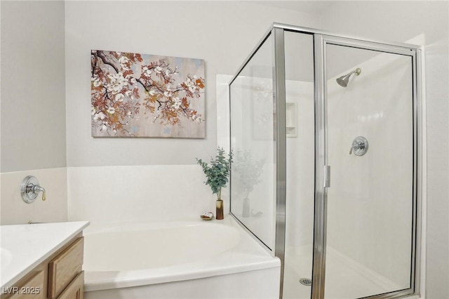 full bath featuring vanity, a shower stall, and a bath