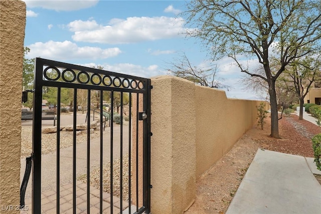 view of gate with fence