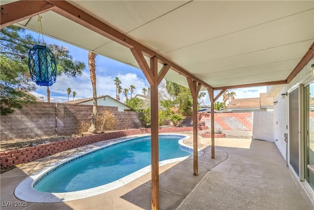 view of pool with a fenced in pool, a patio, and a fenced backyard