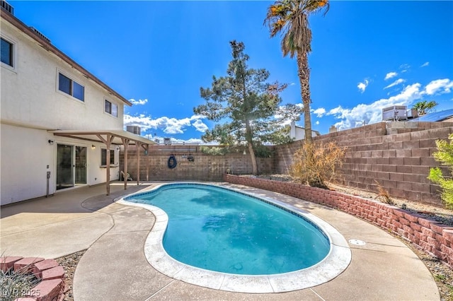 view of swimming pool with a fenced in pool, a patio, and a fenced backyard