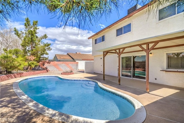 view of pool with a patio, fence, and a fenced in pool