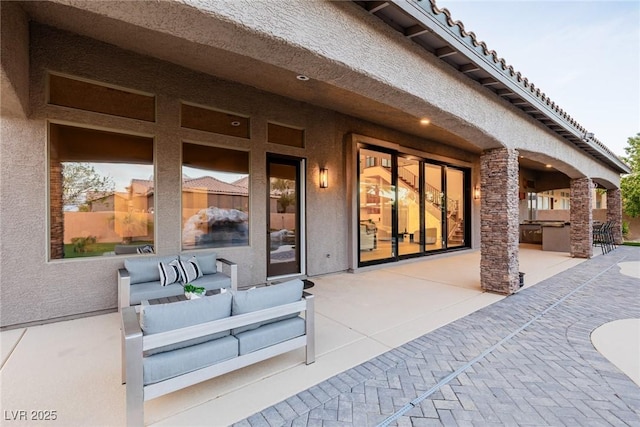 view of patio with outdoor lounge area and area for grilling