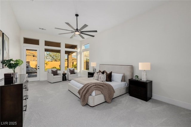 bedroom featuring light colored carpet, visible vents, a ceiling fan, access to outside, and baseboards