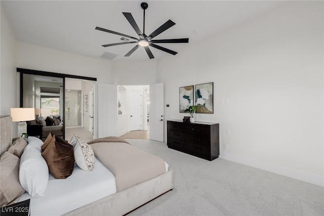 carpeted bedroom featuring ceiling fan, visible vents, and baseboards