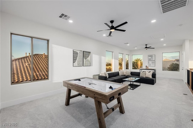 rec room with recessed lighting, visible vents, and light carpet