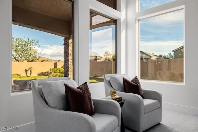 interior space with a wealth of natural light and baseboards