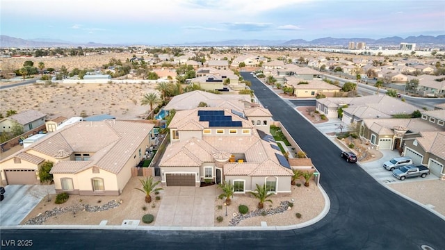 birds eye view of property with a mountain view and a residential view