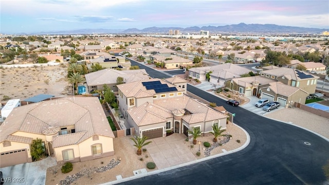 birds eye view of property with a mountain view and a residential view