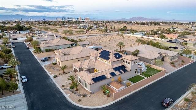 birds eye view of property with a residential view and a mountain view