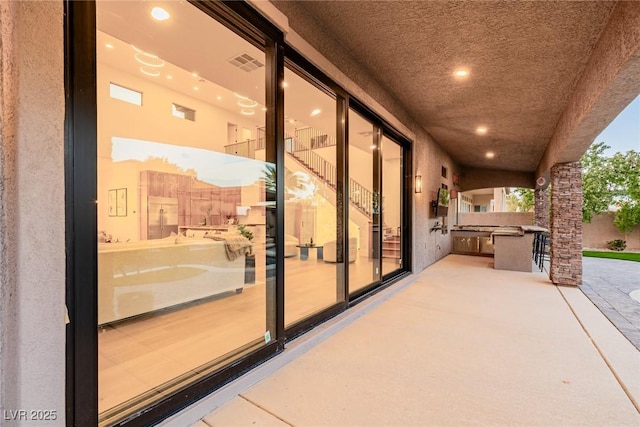 view of patio / terrace featuring area for grilling and visible vents