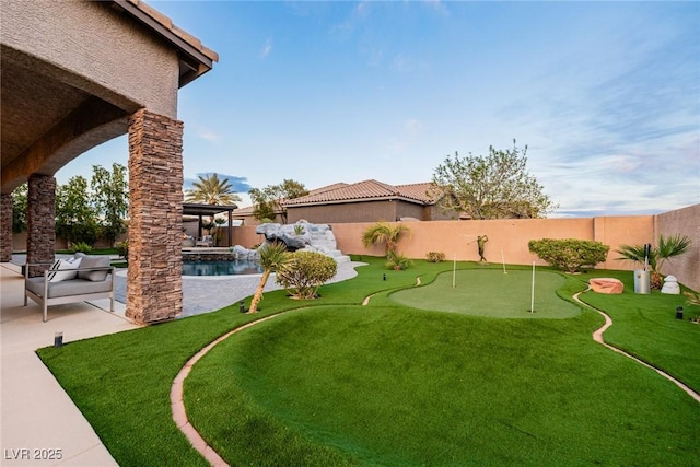 view of yard with a patio area, a fenced backyard, and a fenced in pool