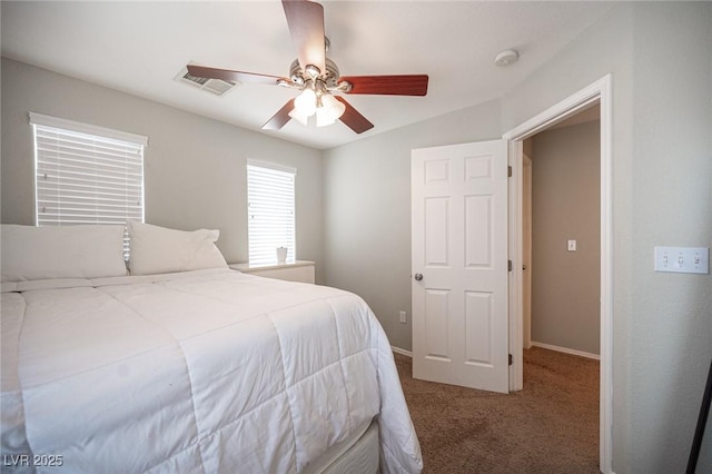 bedroom with carpet flooring, ceiling fan, visible vents, and baseboards