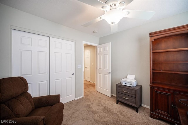 sitting room featuring light carpet, ceiling fan, and baseboards