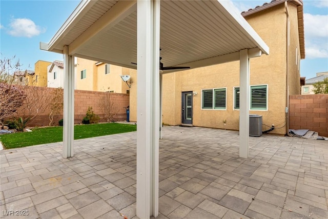 view of patio / terrace featuring a fenced backyard and central air condition unit