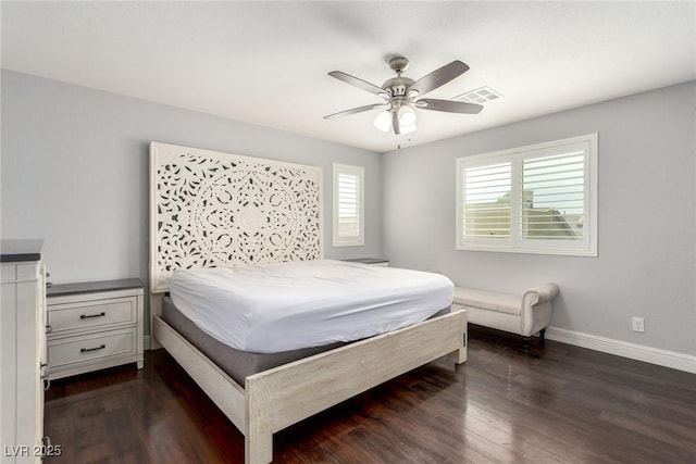 bedroom with dark wood-type flooring, visible vents, baseboards, and a ceiling fan