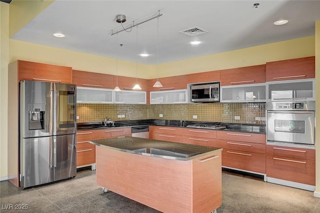 kitchen with stainless steel appliances, modern cabinets, and decorative backsplash