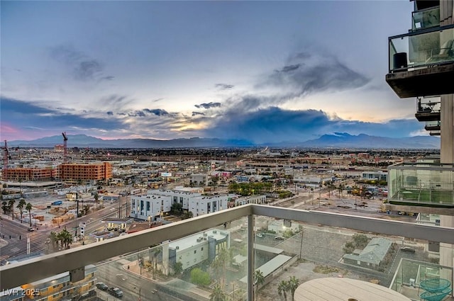 balcony with a city view and a mountain view