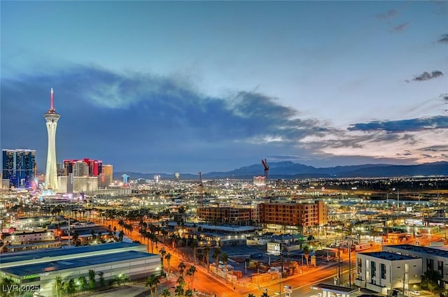 property's view of city with a mountain view