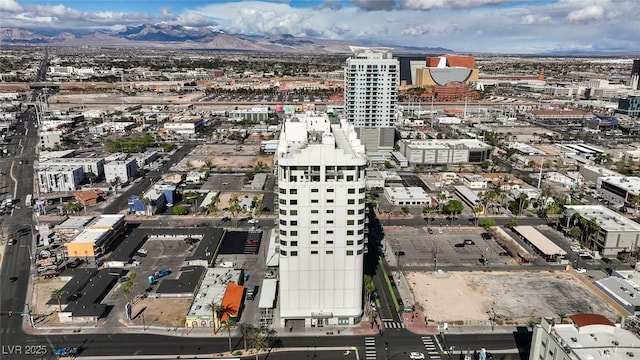 drone / aerial view with a mountain view and a city view