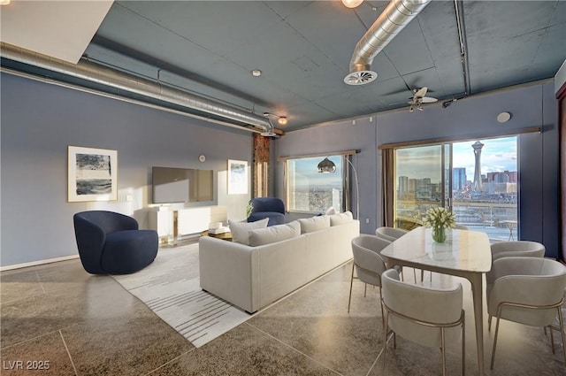 living area featuring speckled floor and visible vents