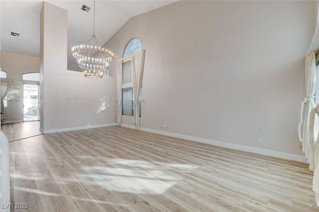 unfurnished room with light wood-style flooring, baseboards, and visible vents